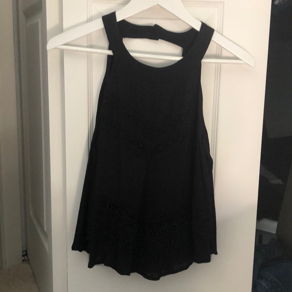 Black halter top. Crochet pattern on front.
